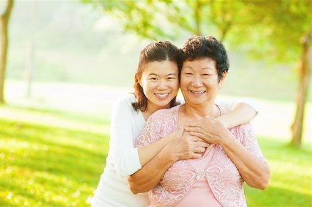 Asian senior mother and adult daughter at outdoor park Stock Photo - Budget Royalty-Free & Subscription, Code: 400-06479242