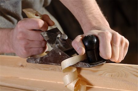 simsearch:700-00081166,k - Man hands with carpenter's plane on wooden background Fotografie stock - Microstock e Abbonamento, Codice: 400-06479485