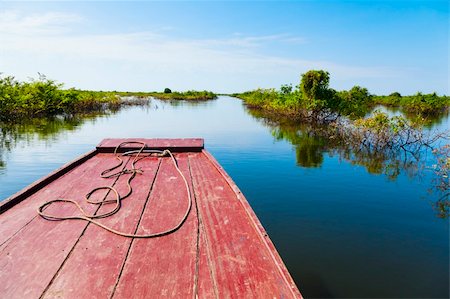 Boat is navigating through vegetation in Tonle Sap Lake in Cambodia Stock Photo - Budget Royalty-Free & Subscription, Code: 400-06479629