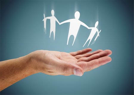 Family in Hand - Caring or helping conceptual image. Stock Photo - Budget Royalty-Free & Subscription, Code: 400-06471966