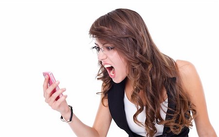 Girl screaming to mobile phone, white background Foto de stock - Royalty-Free Super Valor e Assinatura, Número: 400-06473681
