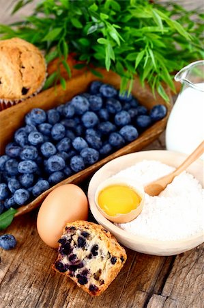 simsearch:400-06698338,k - Muffins with blueberry, egg, flour and milk on wooden table Stock Photo - Budget Royalty-Free & Subscription, Code: 400-06473696