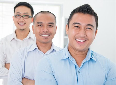 Southeast Asian business group standing in office Stock Photo - Budget Royalty-Free & Subscription, Code: 400-06484568