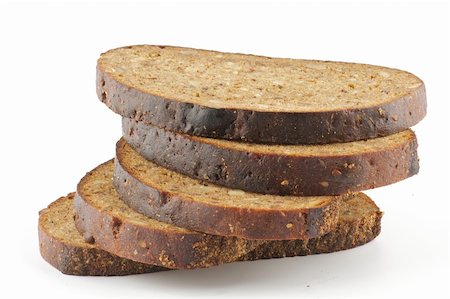 simsearch:640-01354973,k - Slices of whole wheat brown bread isolated on white background Foto de stock - Royalty-Free Super Valor e Assinatura, Número: 400-06484966