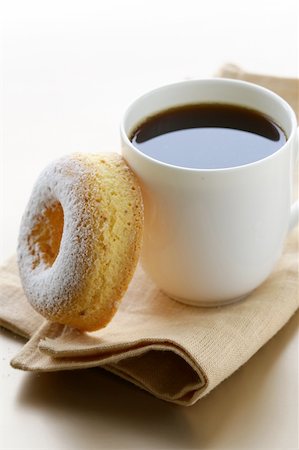 donuts and coffee - Fresh donut sprinkled with powdered sugar and  cup of coffee Stock Photo - Budget Royalty-Free & Subscription, Code: 400-06485054