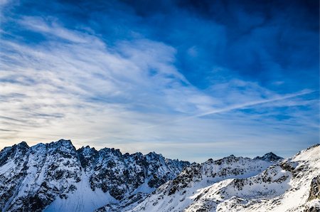 simsearch:400-05038432,k - Winter mountains landscape with dark blue cloudy sky Stock Photo - Budget Royalty-Free & Subscription, Code: 400-06485079