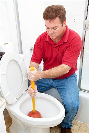 simsearch:400-04728947,k - Man using a plunger to unclog the toilet. Stock Photo - Budget Royalty-Free & Subscription, Code: 400-06485561