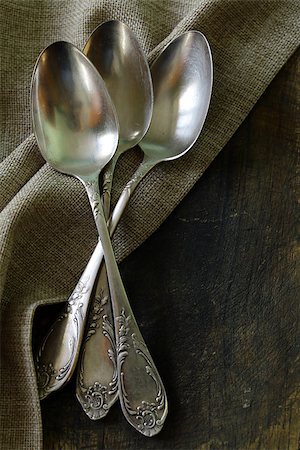 vintage silver cutlery on a wooden background Stock Photo - Budget Royalty-Free & Subscription, Code: 400-06485606
