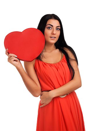 Woman holding Valentines Day heart sign. Isolated over white background Stock Photo - Budget Royalty-Free & Subscription, Code: 400-06485641