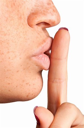 simsearch:6109-06194921,k - Closeup of a woman with her finger over her mouth Stock Photo - Budget Royalty-Free & Subscription, Code: 400-06480013
