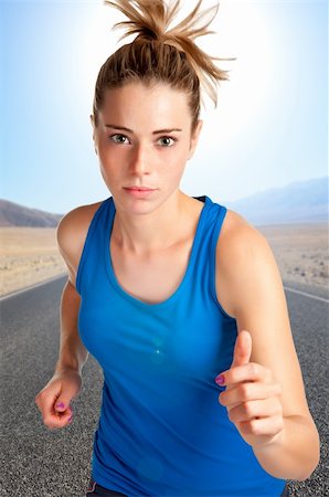 ruigsantos (artist) - Young fit woman jogging,with a road behind and mountains Fotografie stock - Microstock e Abbonamento, Codice: 400-06480027