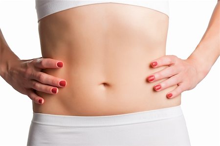 Closeup of a fit womans abs isolated on a white background Stock Photo - Budget Royalty-Free & Subscription, Code: 400-06480034