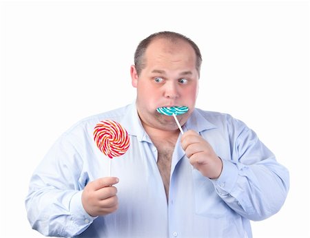 simsearch:400-07305387,k - Fat Man in a Blue Shirt, Eating a Lollipop, isolated Photographie de stock - Aubaine LD & Abonnement, Code: 400-06480139