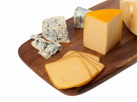 simsearch:400-05682309,k - Different types of cheese on wooden kitchen board. Isolated on white background Stock Photo - Budget Royalty-Free & Subscription, Code: 400-06480284