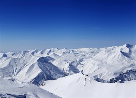 simsearch:400-07219033,k - Panoramic view on snowy mountains in nice day. Caucasus Mountains, Georgia, view from ski resort Gudauri. Stock Photo - Budget Royalty-Free & Subscription, Code: 400-06480515