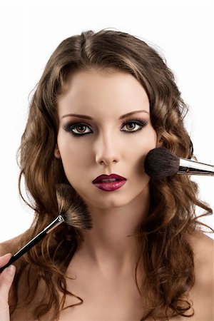 pretty girl with purple make-up and wavy hair and brushes, she looks in to the lens Stock Photo - Budget Royalty-Free & Subscription, Code: 400-06480597