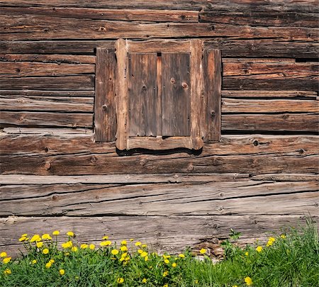 simsearch:400-03975187,k - Wooden textured wall and window, green grass foreground Stock Photo - Budget Royalty-Free & Subscription, Code: 400-06480710