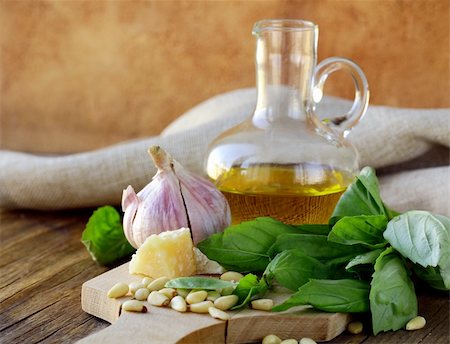 eating olive - ingredients for pesto, basil, olive oil, pine nuts, garlic and parmesan Stock Photo - Budget Royalty-Free & Subscription, Code: 400-06480789