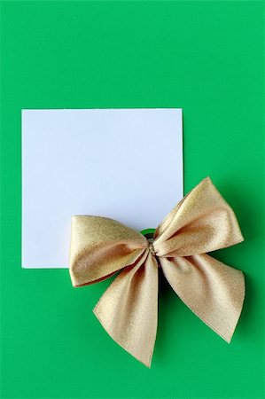 ribbon for greeting card - white blank with a gold bow on a green background Stock Photo - Budget Royalty-Free & Subscription, Code: 400-06480793