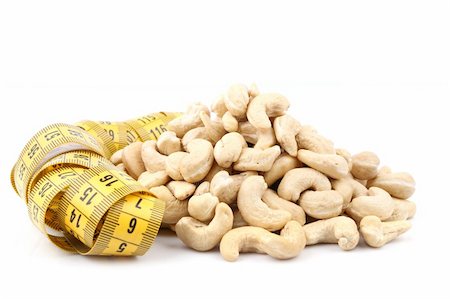 cashew and meter isolated with soft shadow over white background Foto de stock - Super Valor sin royalties y Suscripción, Código: 400-06481023