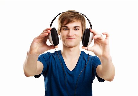 Portrait of a handsome young man showing headphones, isolated on white background Stock Photo - Budget Royalty-Free & Subscription, Code: 400-06481539