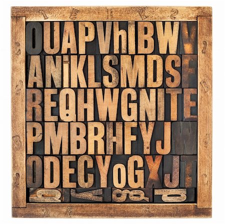 random letters of alphabet - vintage letterpress wood type blocks in rustic box isolated on white Stock Photo - Budget Royalty-Free & Subscription, Code: 400-06481884