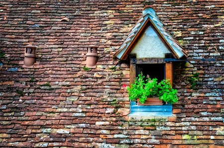 dormir - Old orange vintage retro brick roof with window and flowers Stock Photo - Budget Royalty-Free & Subscription, Code: 400-06482043