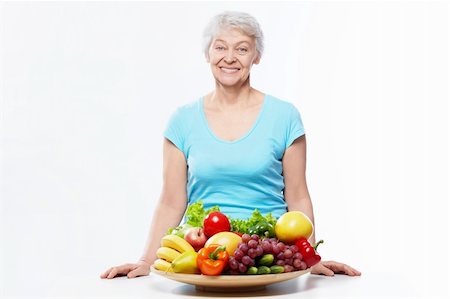 simsearch:400-06482471,k - Elderly woman with fruits and vegetables isolated Stock Photo - Budget Royalty-Free & Subscription, Code: 400-06482459