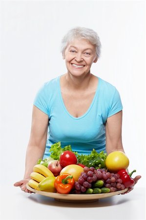 simsearch:400-06482471,k - Elderly woman with fruits and vegetables isolated Stock Photo - Budget Royalty-Free & Subscription, Code: 400-06482460