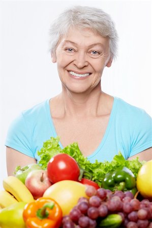 simsearch:400-06482471,k - Elderly woman with fruits and vegetables isolated Stock Photo - Budget Royalty-Free & Subscription, Code: 400-06482461