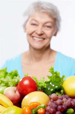 simsearch:400-06482471,k - Elderly woman with fruits and vegetables isolated Stock Photo - Budget Royalty-Free & Subscription, Code: 400-06482462