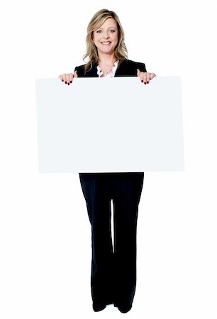 Senior beautiful woman smiling showing blank white placard isolated on white background Stock Photo - Budget Royalty-Free & Subscription, Code: 400-06482632