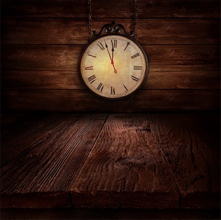 New Year's eve design - Ticking clock. Background with Wooden table with wooden wall with vintage clock close to midnight. Stock Photo - Budget Royalty-Free & Subscription, Code: 400-06517318
