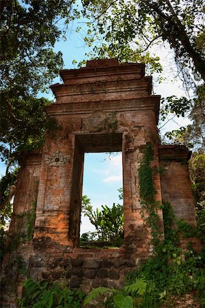 Blue sky through old  ruined Balinese doorway in a forest in Tirthagangga, Bali island, Indonesia Stock Photo - Budget Royalty-Free & Subscription, Code: 400-06518300