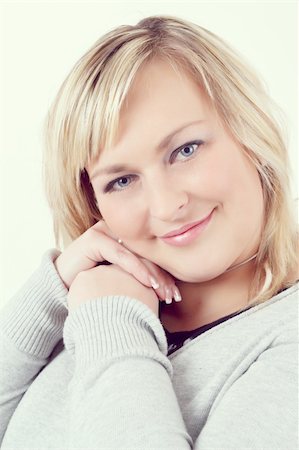 plump girls - Portrait of cute smiling relaxing plump woman Photographie de stock - Aubaine LD & Abonnement, Code: 400-06518325