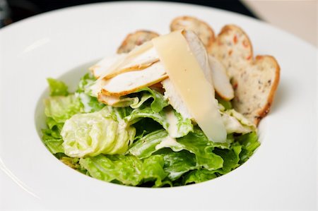 Classic Caesar salad with chicken on a plate Stock Photo - Budget Royalty-Free & Subscription, Code: 400-06518386