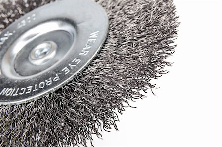 Circular wire brush for cleaning various surfaces with an inscription warning that during operation the tool "wear eye protection" is necessary Foto de stock - Royalty-Free Super Valor e Assinatura, Número: 400-06519993