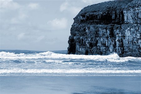 Ballybunion beach and cliffs on the Atlantic coast in Ireland with waves crashing on the cliffs Stock Photo - Budget Royalty-Free & Subscription, Code: 400-06524171