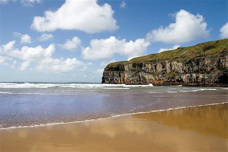 Ballybunion beach and cliffs on the Atlantic coast in Ireland with waves crashing on the cliffs Stock Photo - Budget Royalty-Free & Subscription, Code: 400-06524172