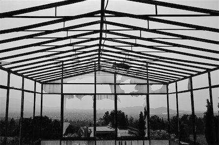 Leaden sky over the city of Athens, Greece. Abandoned building vandalized atrium. Stock Photo - Budget Royalty-Free & Subscription, Code: 400-06524424