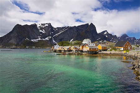 simsearch:400-06946273,k - Traditional fishing village Sakrisoy on Lofoten islands in Norway with typical yellow buildings Photographie de stock - Aubaine LD & Abonnement, Code: 400-06524906