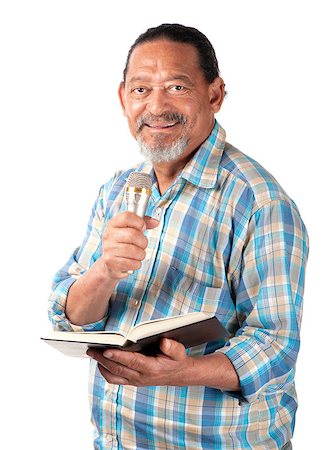 A senior preacher with a microphone and book appears as happy as can be. Stock Photo - Budget Royalty-Free & Subscription, Code: 400-06524922