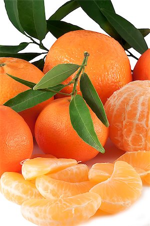 Ripe sweet tangerines with leaves and silces Stock Photo - Budget Royalty-Free & Subscription, Code: 400-06525027
