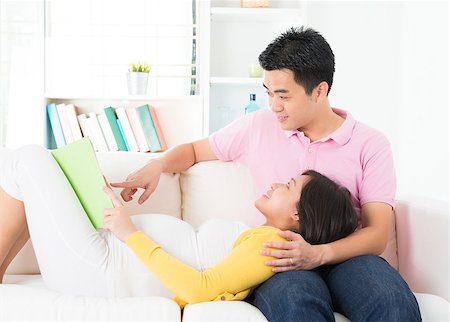 Asian pregnant woman reading book together with husband Stock Photo - Budget Royalty-Free & Subscription, Code: 400-06525112