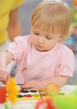 Baby painting on Easter eggs Stock Photo - Budget Royalty-Free & Subscription, Code: 400-06525193