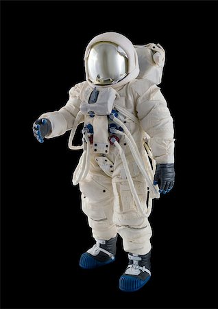 Astronaut wearing spacesuit against a  black background. Stock Photo - Budget Royalty-Free & Subscription, Code: 400-06525438