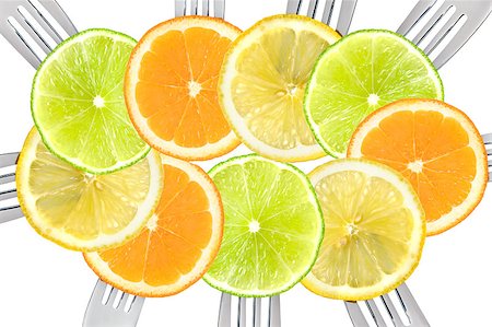 many slices of citrus fruit on forks Stock Photo - Budget Royalty-Free & Subscription, Code: 400-06526025