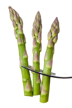 eelnosiva (artist) - fresh asparagus on fork isolated over white background Foto de stock - Royalty-Free Super Valor e Assinatura, Número: 400-06526034