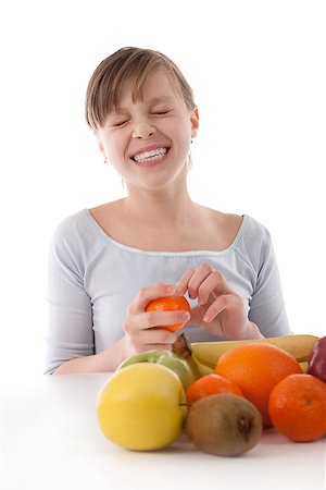Image of a girl with fruit on white Stock Photo - Budget Royalty-Free & Subscription, Code: 400-06526064