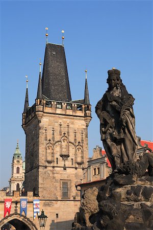 View of ancient sculpture on background with gothic towers in Prague Stock Photo - Budget Royalty-Free & Subscription, Code: 400-06526520